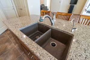Kitchen view of composite grante sink and light quartz countertops