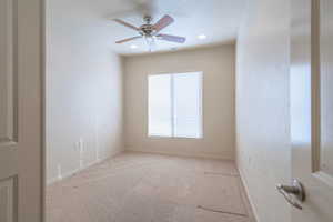 Carpeted den/3rd bedroom room featuring ceiling fan and recessed lighting