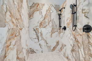 Bathroom view of a marble finish shower