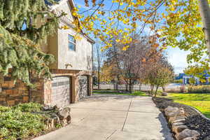 View of patio with driveway and a garage
