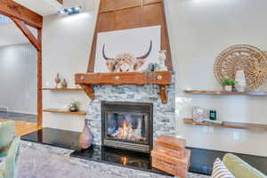 Living area featuring a stone fireplace