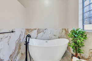 Bathroom featuring a freestanding tub