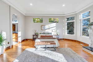 Living room featuring hardwood / wood-style floors, recessed lighting, and crown molding