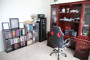 Home office featuring light colored carpet