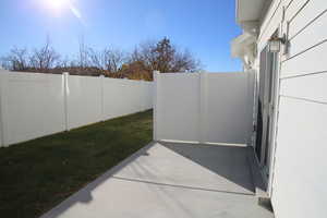 Fenced backyard with a patio area