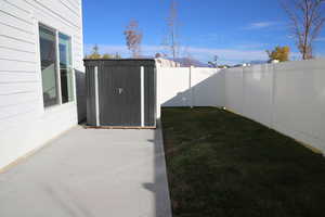 Fenced backyard featuring a patio area