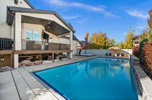 View of pool featuring a patio and a fenced backyard