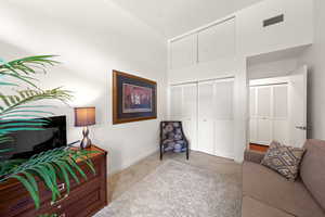 Living area featuring carpet and baseboards