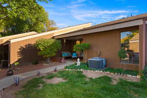 View of grassy yard with a patio area