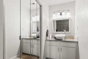 Bathroom with two vanities and baseboards