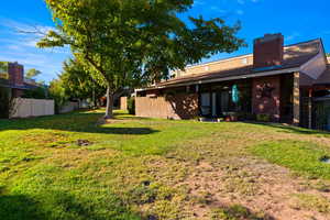 Back of property with a chimney