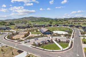 Aerial perspective of suburban area featuring a water and mountain view