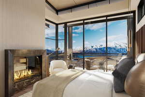 Bedroom featuring a water and mountain view, a fireplace, multiple windows, expansive windows, and access to outside