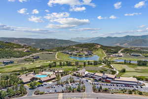 Bird's eye view of a golf club and a water and mountain view