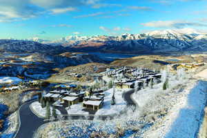 View of mountain backdrop featuring nearby suburban area