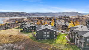 Aerial perspective of suburban area featuring a mountain backdrop
