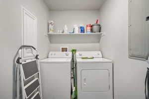Laundry area with independent washer and dryer and electric panel