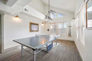 Playroom with plenty of natural light, carpet floors, and a high ceiling