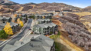 Aerial perspective of suburban area featuring a mountain backdrop