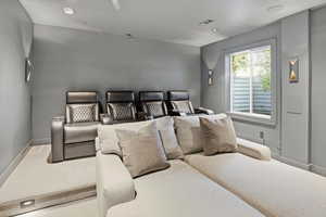 Cinema room featuring baseboards and recessed lighting