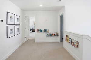 Rec room with carpet flooring and baseboards