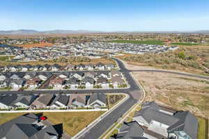 Aerial view of property's location with nearby suburban area