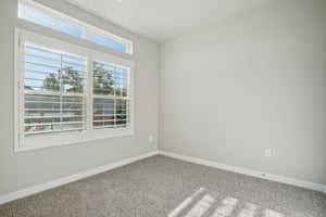 Empty room featuring baseboards