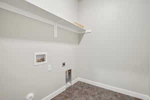 Laundry room with electric dryer hookup, washer hookup, and dark colored carpet