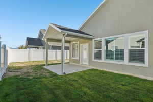 Back of house featuring a patio area and a fenced backyard