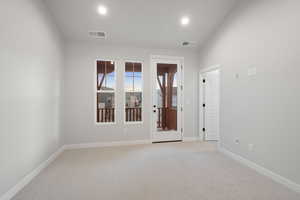 Unfurnished room featuring light carpet and recessed lighting