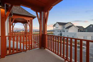 Balcony at dusk with a residential view