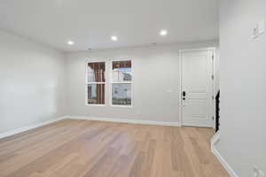Entrance foyer featuring recessed lighting and light wood finished floors