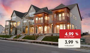 View of front of property featuring stucco siding, stairs, a balcony, a shingled roof, and a porch