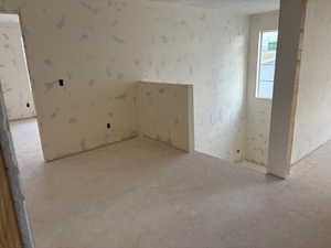 Unfurnished room with a textured ceiling