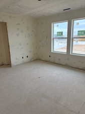 Empty room featuring a textured ceiling