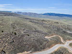 Overview of rural landscape featuring a mountain backdrop
