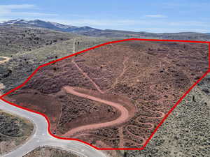 Aerial view of sparsely populated area featuring mountains and a desert landscape