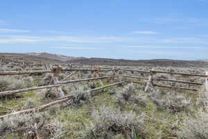 View of yard featuring a view of countryside and a mountain view