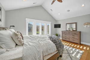 Bedroom featuring recessed lighting, light wood-style floors, a ceiling fan, and high vaulted ceiling