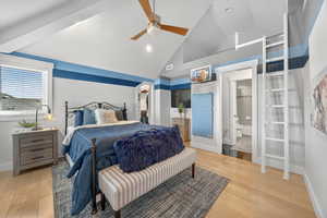 Bedroom featuring a walk in closet, ceiling fan, light wood finished floors, high vaulted ceiling, and beamed ceiling
