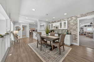 Loft Area with a textured ceiling, dark wood-style flooring, recessed lighting, and a kitchenette