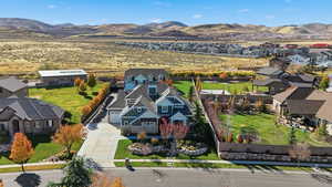 Aerial perspective of suburban area featuring a mountain backdrop
