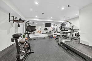 Gym with rubber floors and recessed lighting