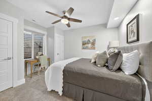 Bedroom with carpet floors, a ceiling fan, and recessed lighting