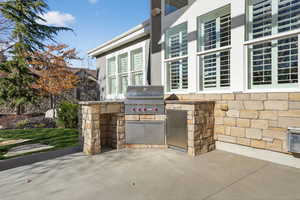 View of patio featuring area for grilling