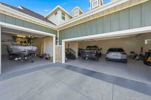 Garage featuring concrete driveway