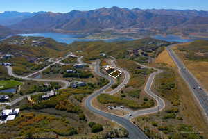 Aerial overview of property's location with a water and mountain view