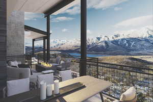 View of patio with an outdoor living space with a fire pit, a water and mountain view, and outdoor dining space