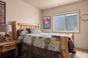 Tiled bedroom with baseboards