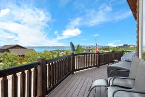 Wooden deck featuring a water and mountain view